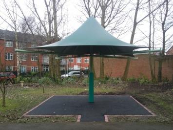 The steelwork support frame, the umbrella fabric & the