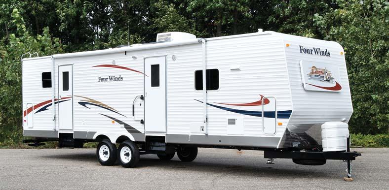 All Four Winds large slide travel trailers feature large, flush floor slide rooms