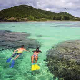 This stunning paradise of crystal clear waters, corals, pristine beaches and spectacular mountains off ers guests the opportunity to see nature at its fi nest and get up close with fascinating