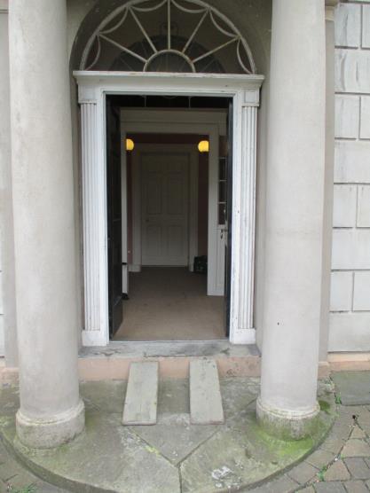 2 Entrance Area Access to the Old House of Keys is through a single door, 100cm wide. There is a slight step (5cm depth) leading to a larger stone step.