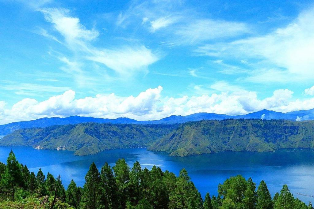 Visitors to Lake Toba (above), which sits 900m above sea level, can enjoy a cooler c