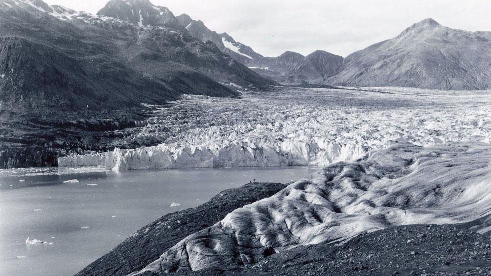 Taken on Wachusett Inlet in the Saint Elias Mountains of Alaska, this photo from September 1961 shows the lower reaches of Plateau Glacier, then a tidewater calving valley
