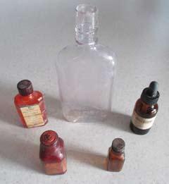Vintage Old Bottles. ½ Pint Glass Bottle, 1 oz. Mercurochrome from Rexall Drug Company, 1 oz.