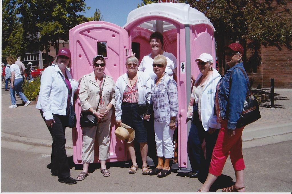 Thanks Mary Ann, Jim, and Kari We did what????? Yes we did, as you can see in the picture the LCCC travel girls posed for pictures in front of the ladies PINK Porta Potty.