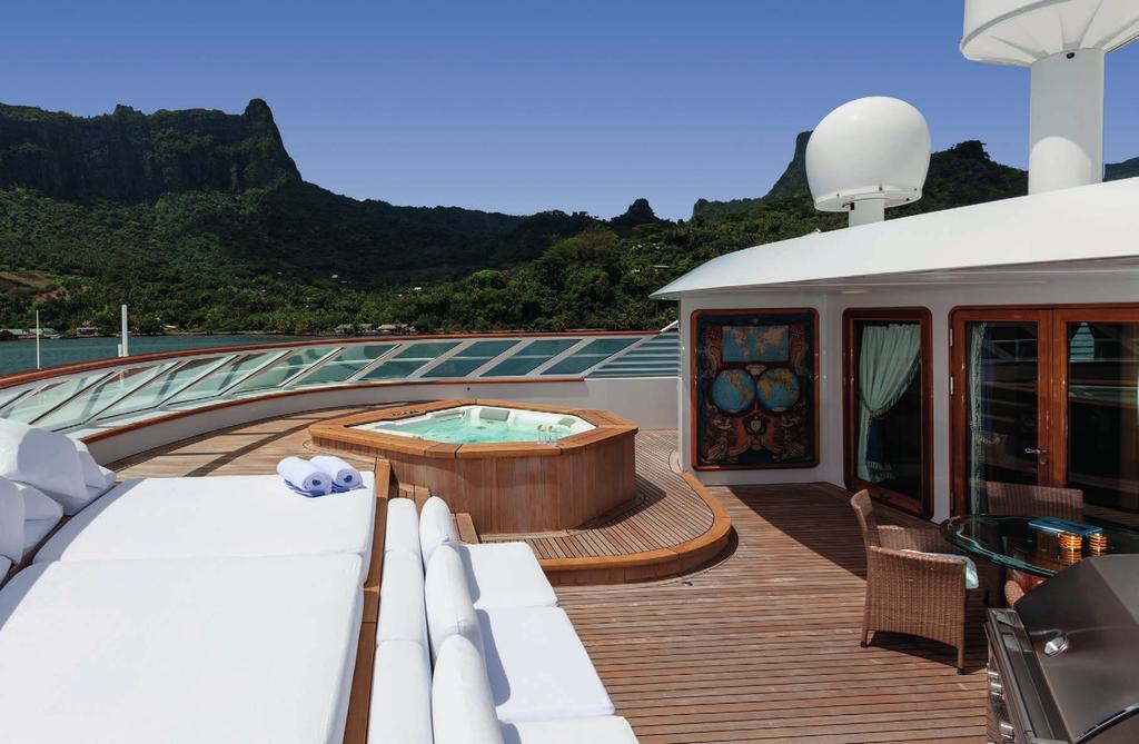 TOP DECK The top deck is a comfortable area for lounging, featuring a jacuzzi with sun pads, a gas BBQ