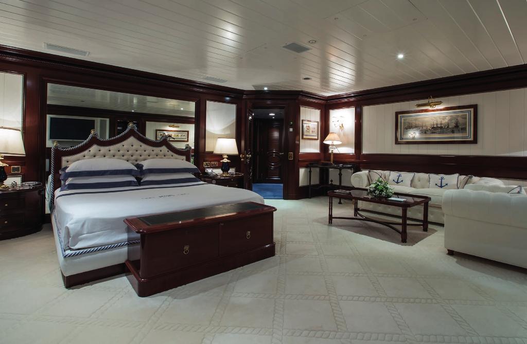 Owner s Suite The handsome carved wooden bed sets the luxurious tone for this master stateroom.