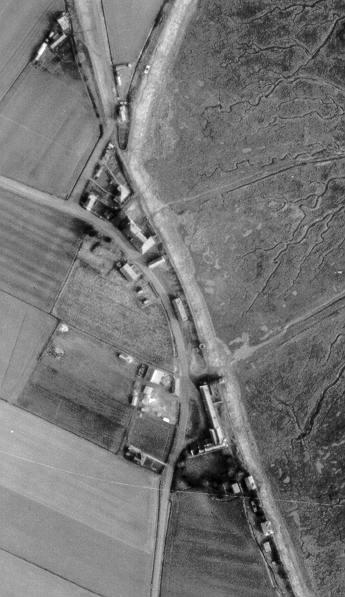 Fig. 3 - Portion of an air photograph taken in 1953, showing [towards the bottom edge] the buildings of the Freiston Shore Battery, with pitched roofs concealing the two 6in gun emplacements.