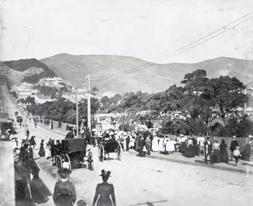28 March 1900: Crowds walk east on Buckle Street to Basin Reserve, on the right, for a Māori