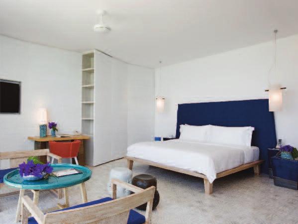 21 Bay Suites (100m2 / 1080 sq.ft): The Bay Suites have an indoor dining tabe with two chairs, a guest bathroom, separate iving room and bedrooms with baconies overooking both Phang Nga and Yamu Bay.