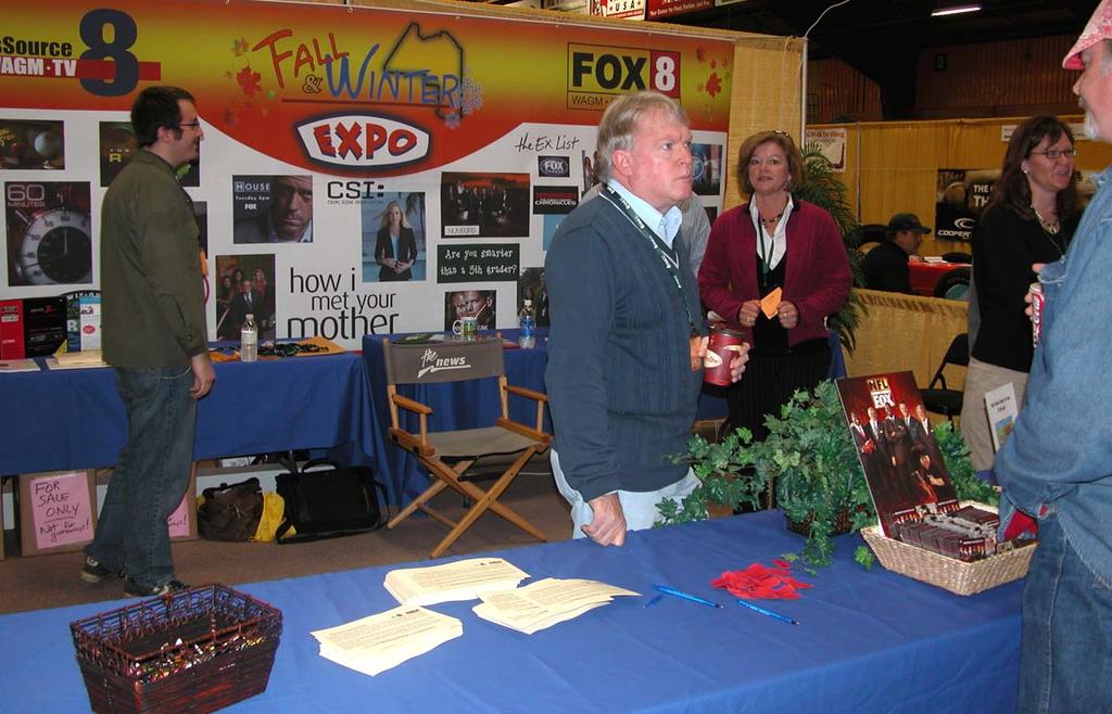 Dick Palm (center), morning news anchor for WAGM-TV, was one of the station s celebrities that attendees had a chance to meet and visit with during the Fall & Winter Expo.