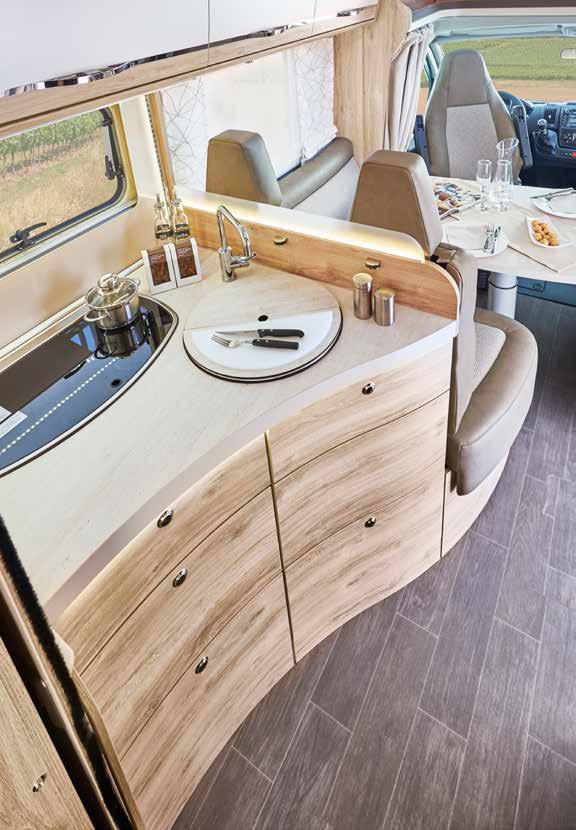The kitchen in your Eura Mobil offers modern furniture with a