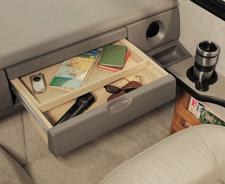 PASSENGER SIDE AMENITIES include a pull-out drawer to conveniently store items you'll need on the road, a cup holder for drinks and a magazine rack for reading material.