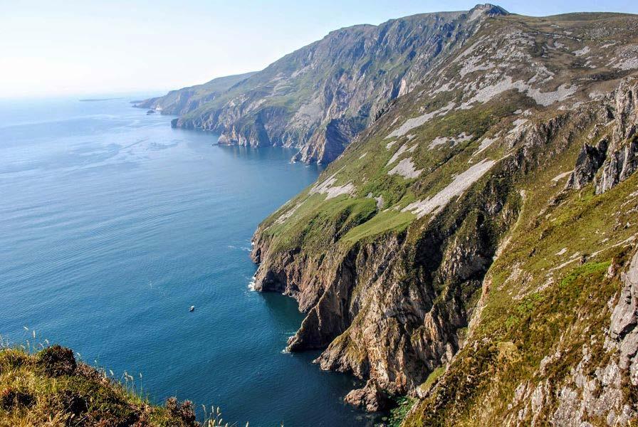 Day 7 Slieve League Cliffs Today, we will visit some of the highest sea cliffs in Europe. The gigantic awe-inspiring façade of the Slieve League cliffs plunge some 600m into the sea below (1,670 ft).