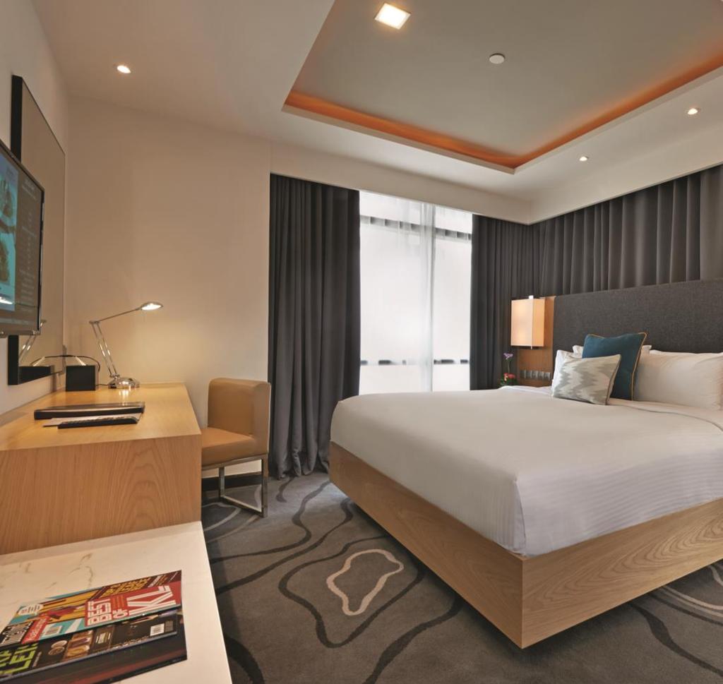 ROOM TYPE: CLUB PREMIER SUITE Enjoy this plush space to call your own with abundant natural lighting that enhances the entire luxurious stay experience with splendid city views.