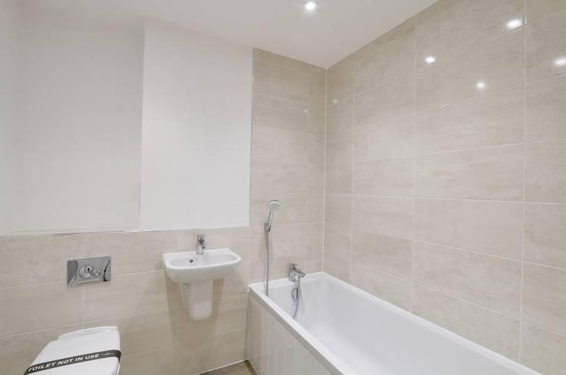 Also, accessible from the entrance hall is the master bedroom benefitting from an en suite shower room, two additional bedrooms and a family bathroom with WC.