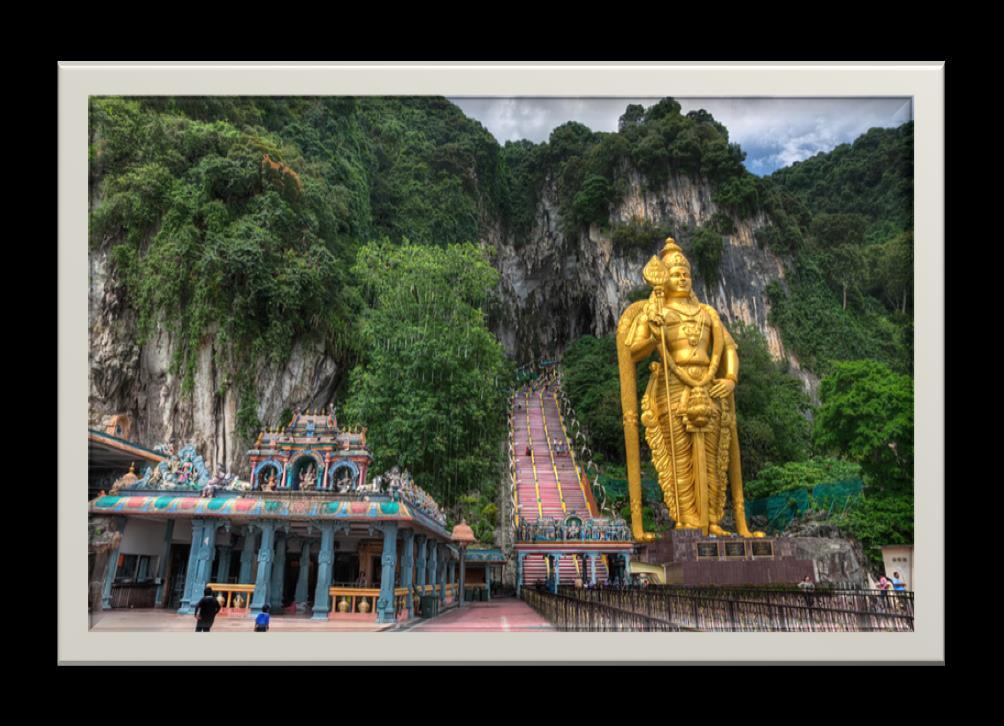 BATU CAVES TOUR A few minutes away from Kuala Lumpur, in the limestone cliffs covered with dense tropical vegetation, you can find enormous hidden cave.