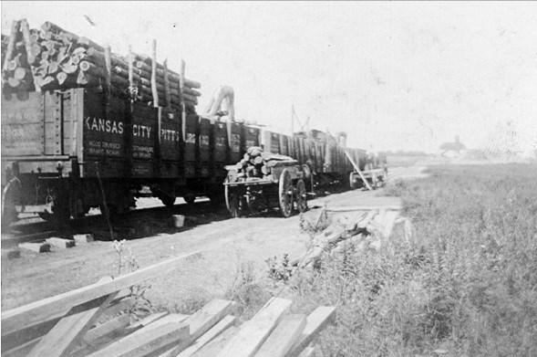 Kansas City, Pittsburg & Gulf coal cars are being unloaded on the Bonanza tracks near