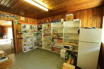 Home has carpet and sheet vinyl flooring, central vacuum, appliances, covered patio, forced air propane and wood furnace.