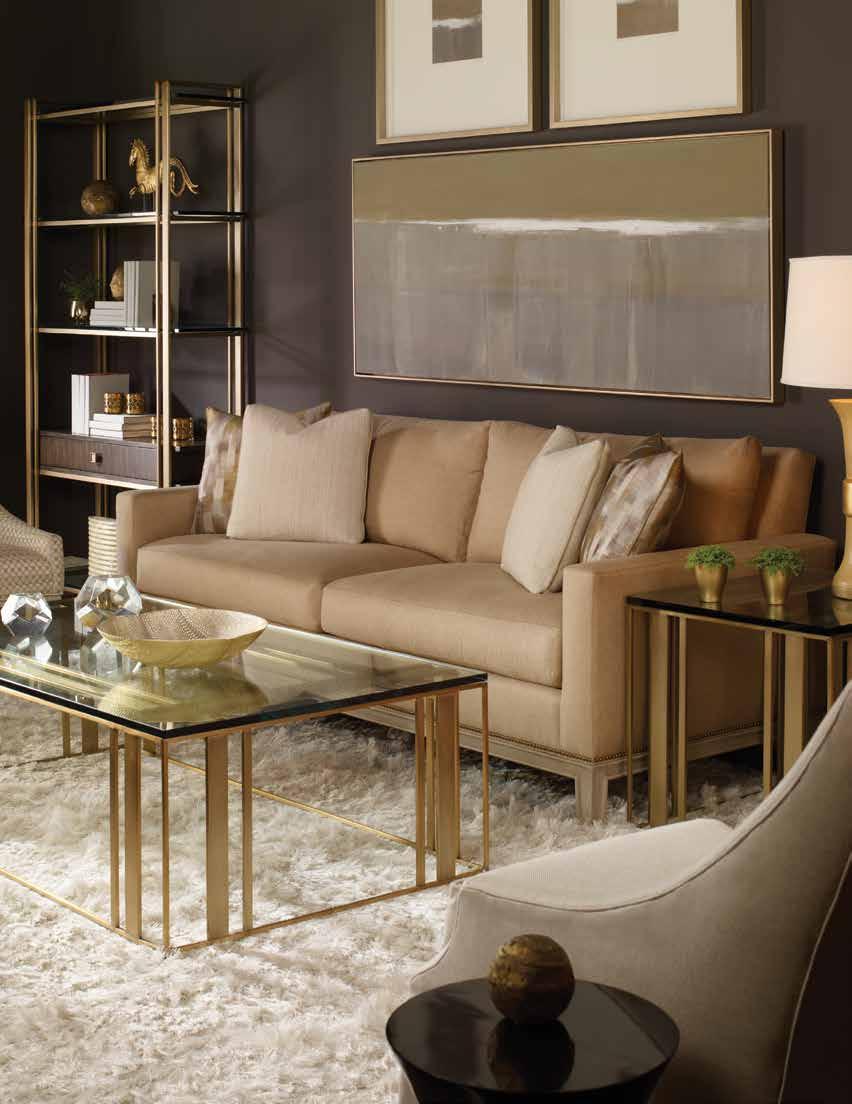 Left to Right: V1080-CH Weaver Chair. Fabric: Hickory Oyster. Finish: Wrenn. P220EG-AA Wallace Etagere. Finish: Amarone (wood); Satin Brass (metal). Glass Shelves. V936-2S Julian Sofa.