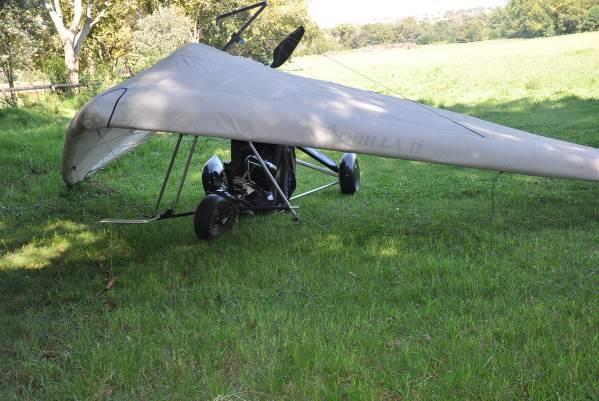 some tall, thick grass before the prepared landing strip runway. On contact with the grass, the microlight rolled over and came to rest inverted, facing in a northwesterly direction.
