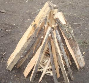 Campfire - Tepee This is a favorite and many believe the most useful and easiest to light. Place your tinder bundle on the ground or on a small piece of bark.