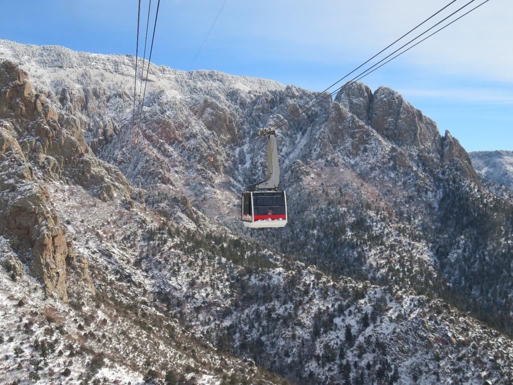 GONDOLA RIDE 20 MINUTES FROM THE HOTEL CHACO The Sandia Tram to the peak of the mountain at 10,679 feet is open all summer and has a great view of the city and desert below.