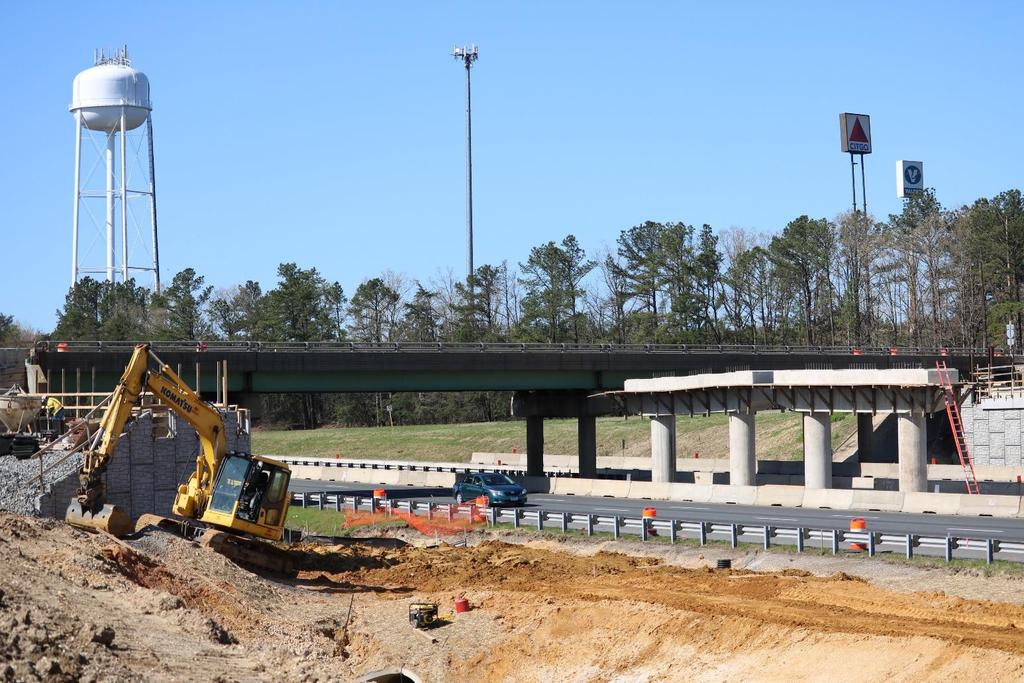Exit 118 Overpass and Interchange Improvements New 4-lane overpass improves sight distance on Mudd Tavern Road Replaces structurally deficient bridge