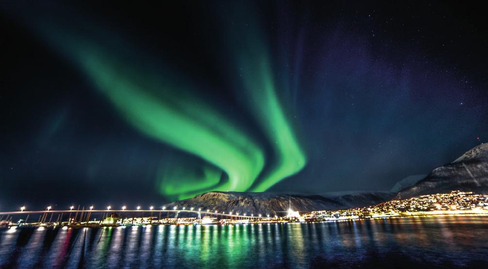 enlighten Located in northern Norway, the city of Tromsø sits right above the Arctic Circle.