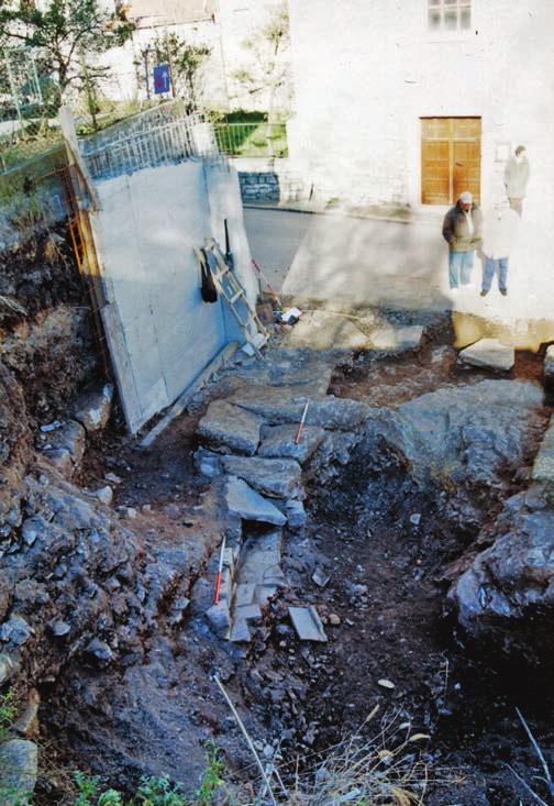 7e A view of the excavated channel in Castropola Street, showing the visible flagstones of a Roman road, during the archaeological explorations in 1999 (photography: R.