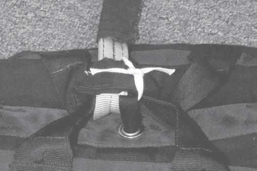 on the top of the outer deployment bag using a lark's head knot.