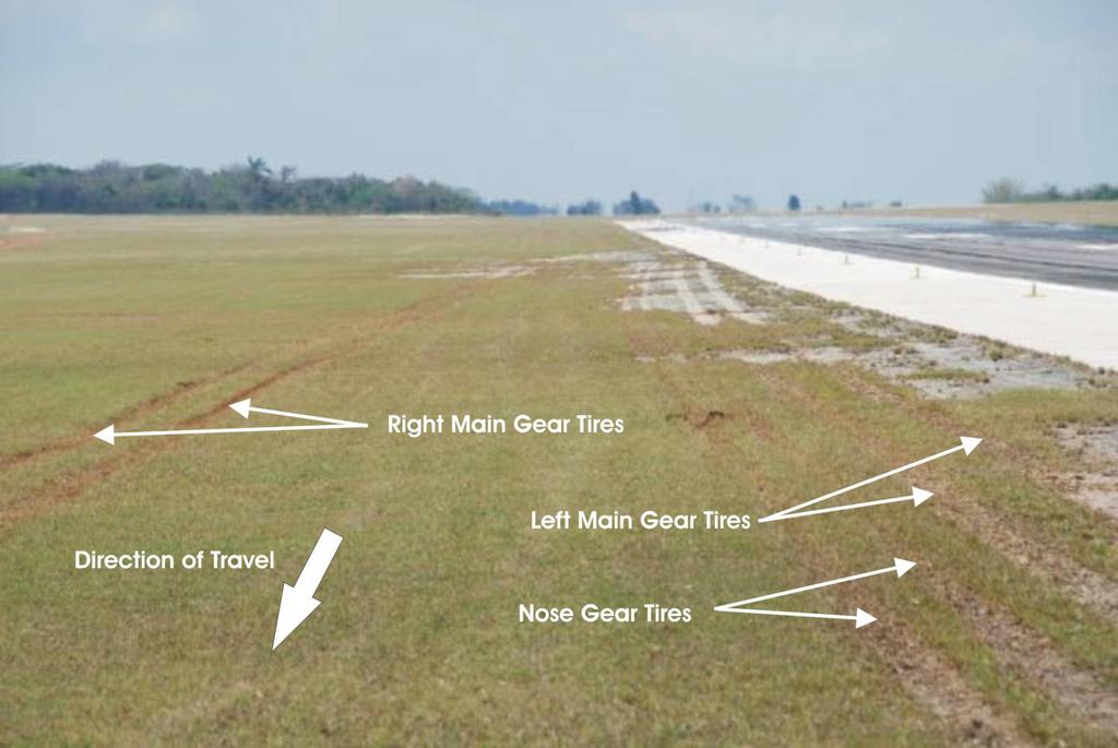 - 4 - Photo 1. Tire tracks off the runway Weather A few thunderstorms were encountered in the descent toward MUVR.