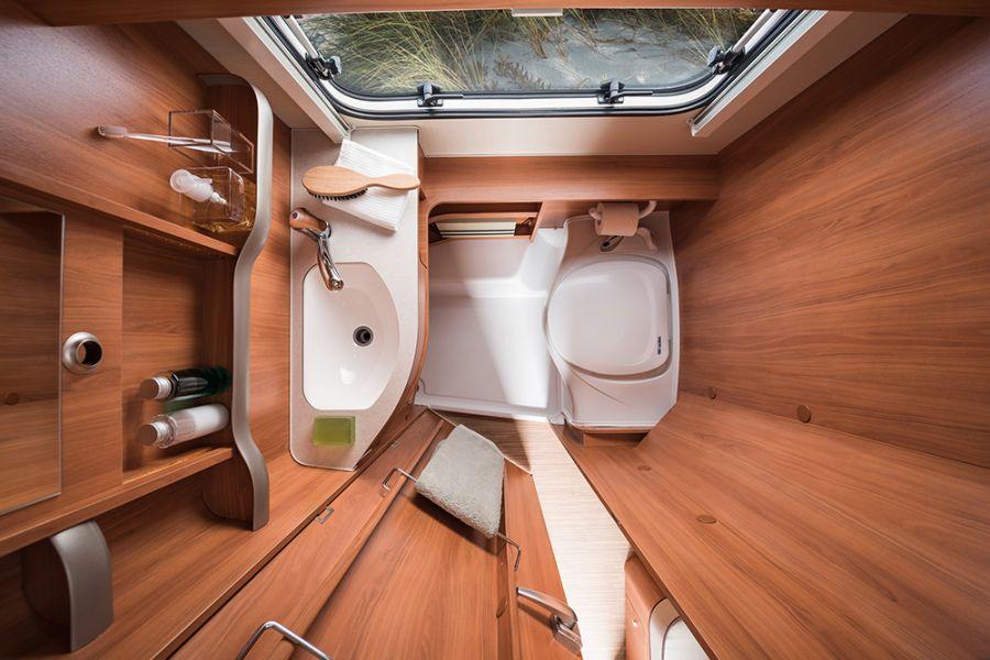The comfortable bench toilet is installed as standard in ERIBA Touring models with a bathroom. The washbasin on the opposite side provides ample storage space.