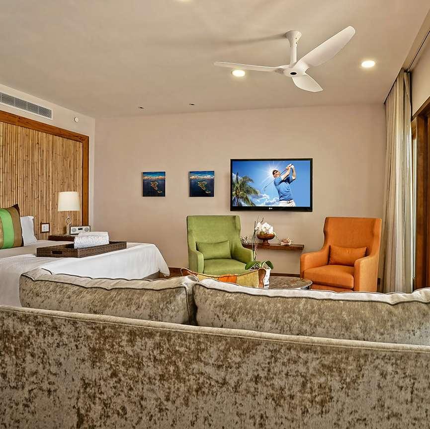 Beachfront Junior Suite King or Two Twins ALL PACKAGES INCLUDE Four nights in accommodation of choice at The Reef by CuisinArt. Complimentary meet & greet at St.