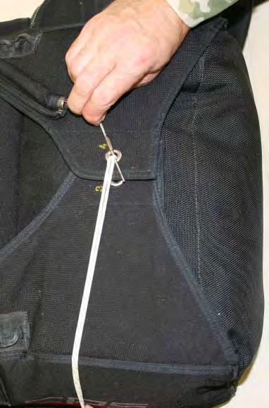 3.8.8. Thread the pull-up cord through the grommet on Flap-4 and pull the closing loop through the grommet until it