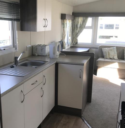 Our Caravans Our caravans have a spacious lounge with dining area, a gas fire, television and DVD player.