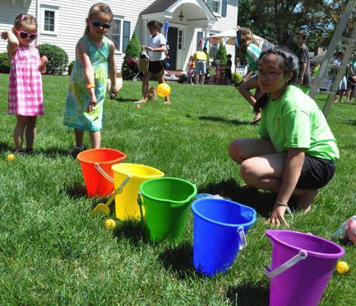 9. Bucket Toss: Get colored buckets and plastic golf or ping pong balls. Put numbers on each bucket.