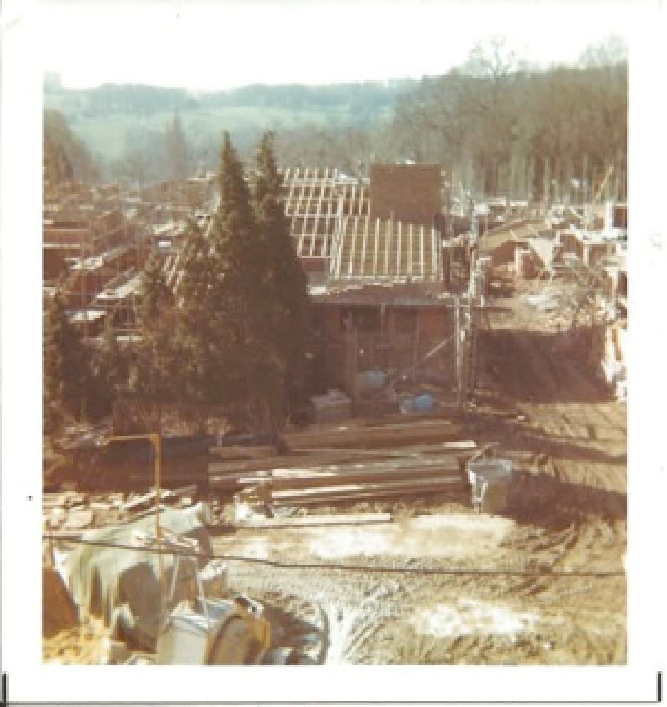 The previous buildings on the site were demolished in 1972. Some construction was started soon after, with the houses on the upper part of the estate being completed first.