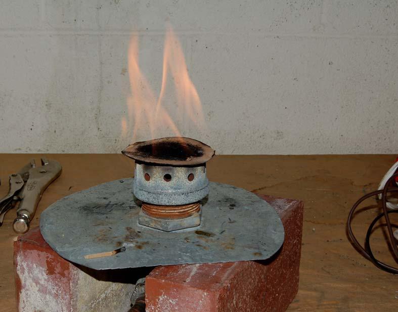 Figure 1: The basic burner being used as a simulated open fire. In each test the primary measured quantity was the total heat transfer rate to the pot.