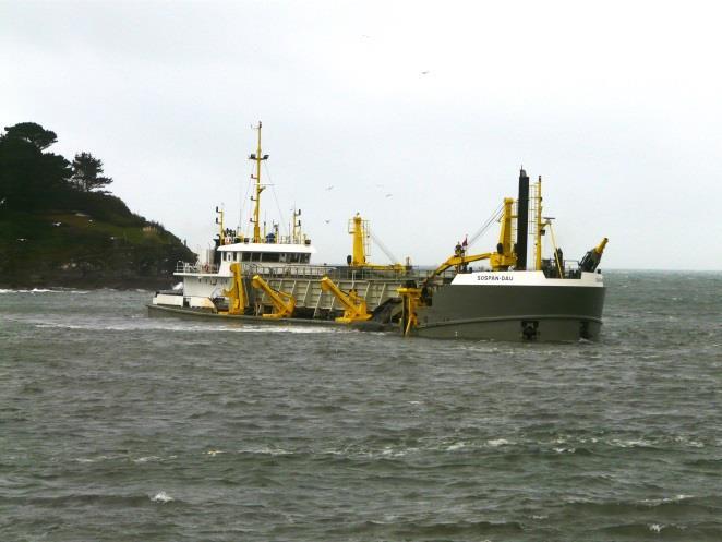 Dredging in the harbour mouth up to the telephone cable and sewage
