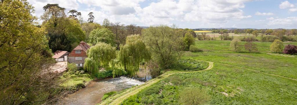 Lodsbridge Mill, Selham, West Sussex A small estate with an 18th Century former watermill on the banks of the River Rother, separate 17th Century cottage, spa complex and stabling, total 18.