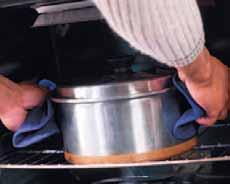 TEACH cont. Protect Yourself Oven mitts protect your hands and lower arms from burns when you reach into a hot oven. What is the correct way to remove a pan from the oven?