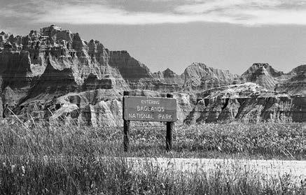 A long wall of ragged vertical peaks and deeply eroded ridges stretches for a hundred miles across southwestern South Dakota.