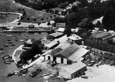 In this picture, the boat building sheds and slipways are clearly visible.