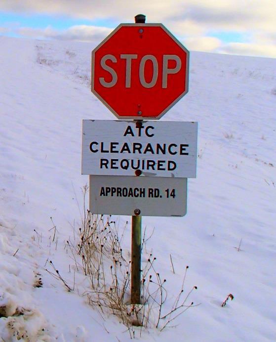 15.06 ATC clearance signs ATC Clearance Signs are located on all access roads accessing the manoeuvring area 200 feet from the edge of the manoeuvring