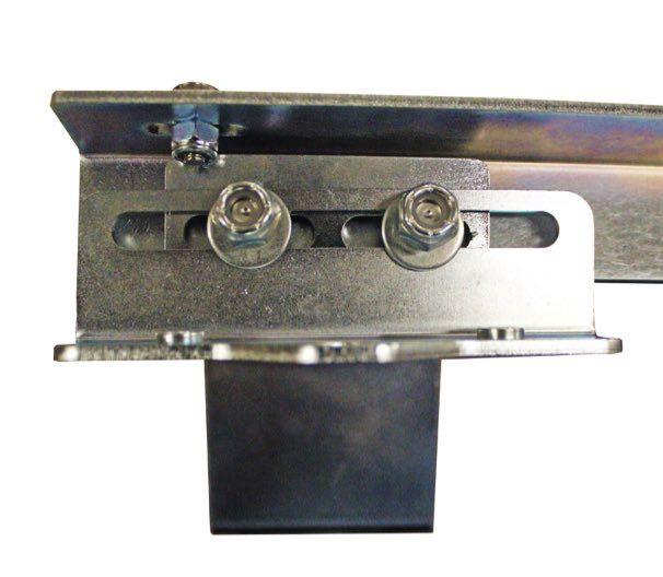 Place a small washer and a nut on each standoff, center the standoffs in the slots of the upper and lower brackets, and tighten securely