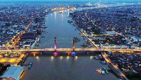 ABOUT PALEMBANG Palembang is the capital of South Sumatra (Sumatera Selatan) province. It lies on both banks of the Musi River, there spanned by the Ampera Bridge, one of Indonesia s longest bridges.