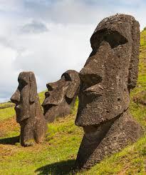 Why did the Rapa Nui form the bodies from grey volcanic rock and pukao from red volcanic rock, all transported to the far reaches of the island?