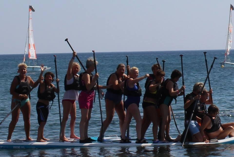 slight exaggeration). In teams of 6-8 women, the eventual winners will have a paddle off, ending with as many of us as possible on the giant paddle board to stand up together UNITED!