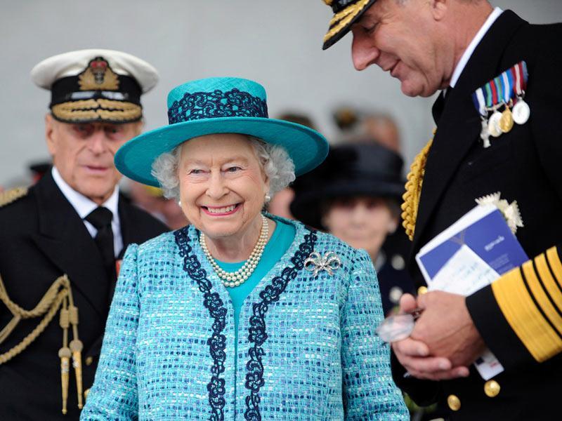 The Queen officially named HMS QUEEN ELIZABETH in front of a crowd including workers who helped build the ship, the Prime Minister and the Defence Secretary.