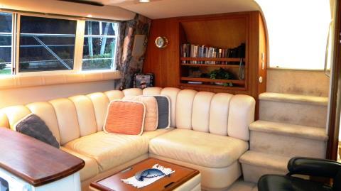 The saloon has a comfortable sofa, recliner with ottoman, a cocktail table that offers